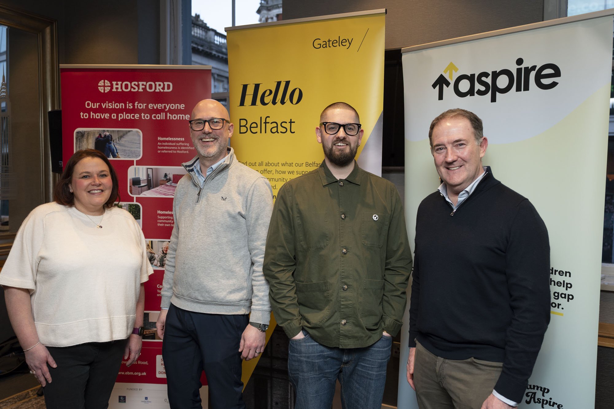 Our team members smile with heads of both charities