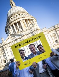 Speakers from BTR event smile in front of St Paul's Cathedral, London