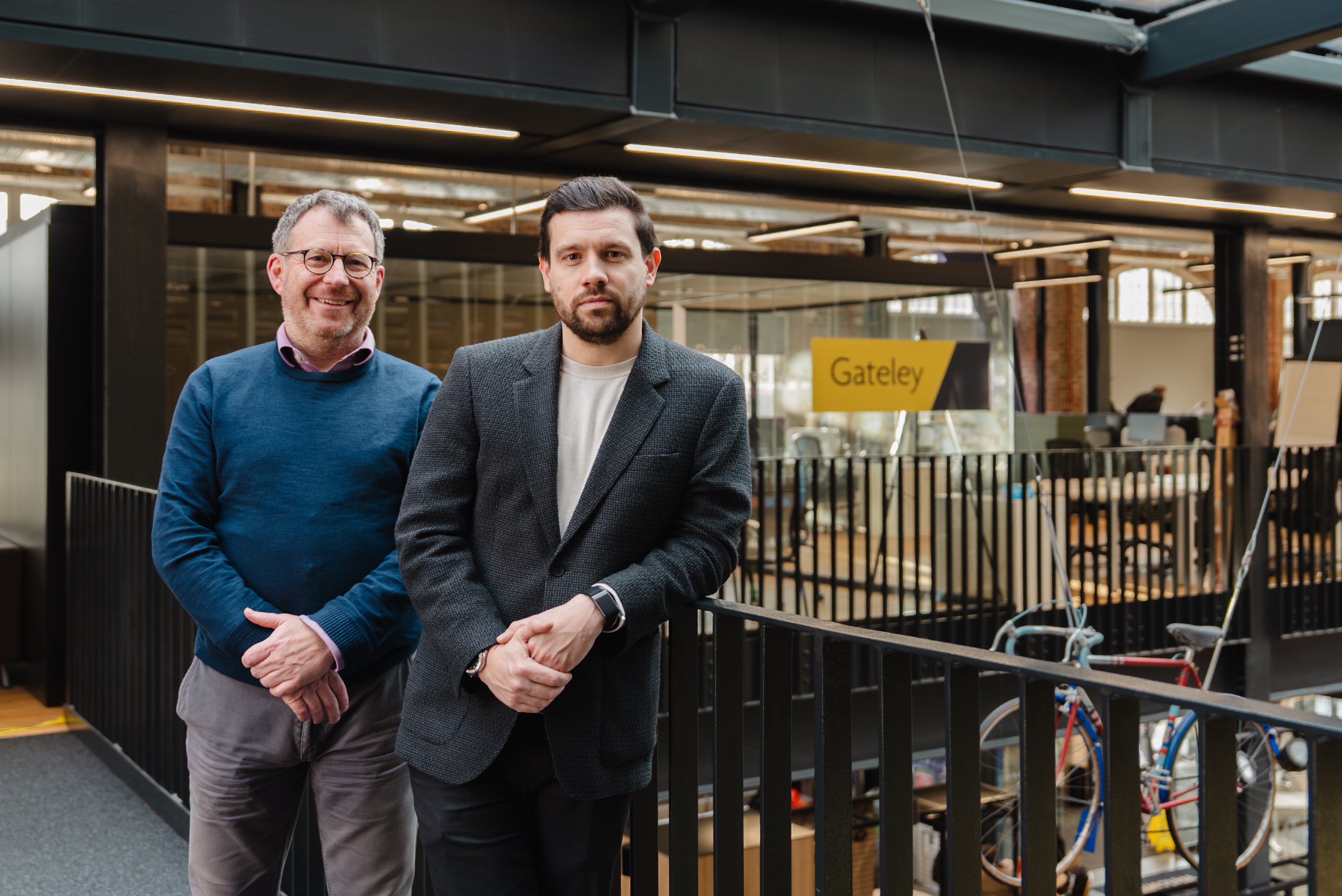 Andrew Hartshorn and Sam Meiklejohn in front of Gateley branding in STEAMhouse