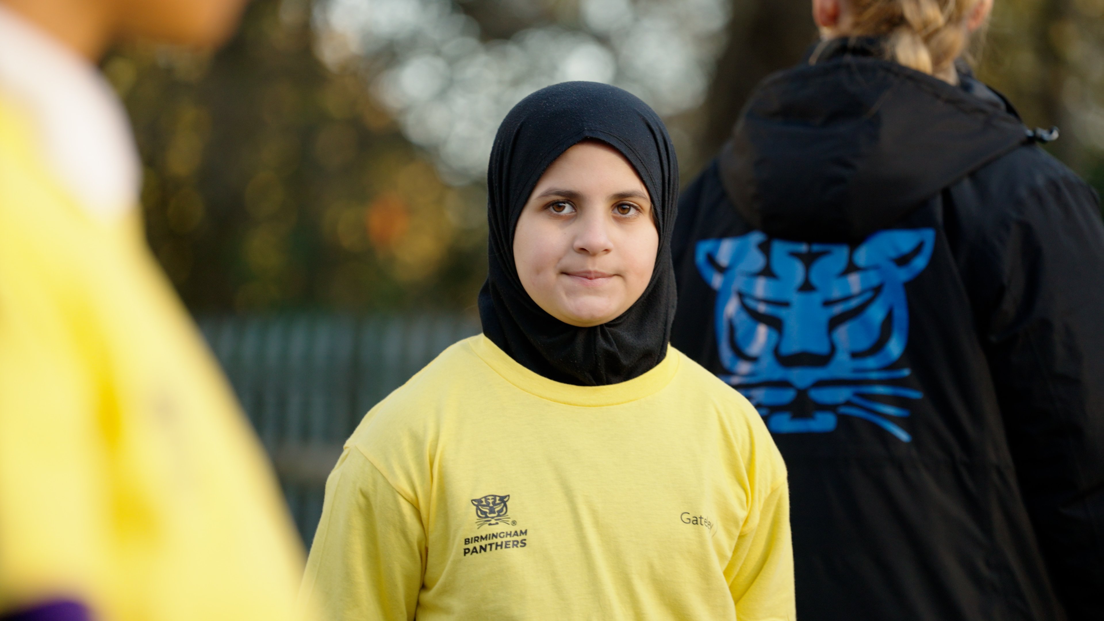 One of the children smiles to camera