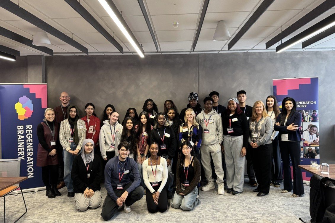 The team from our office smile to camera with the students from Regreneration Brainery