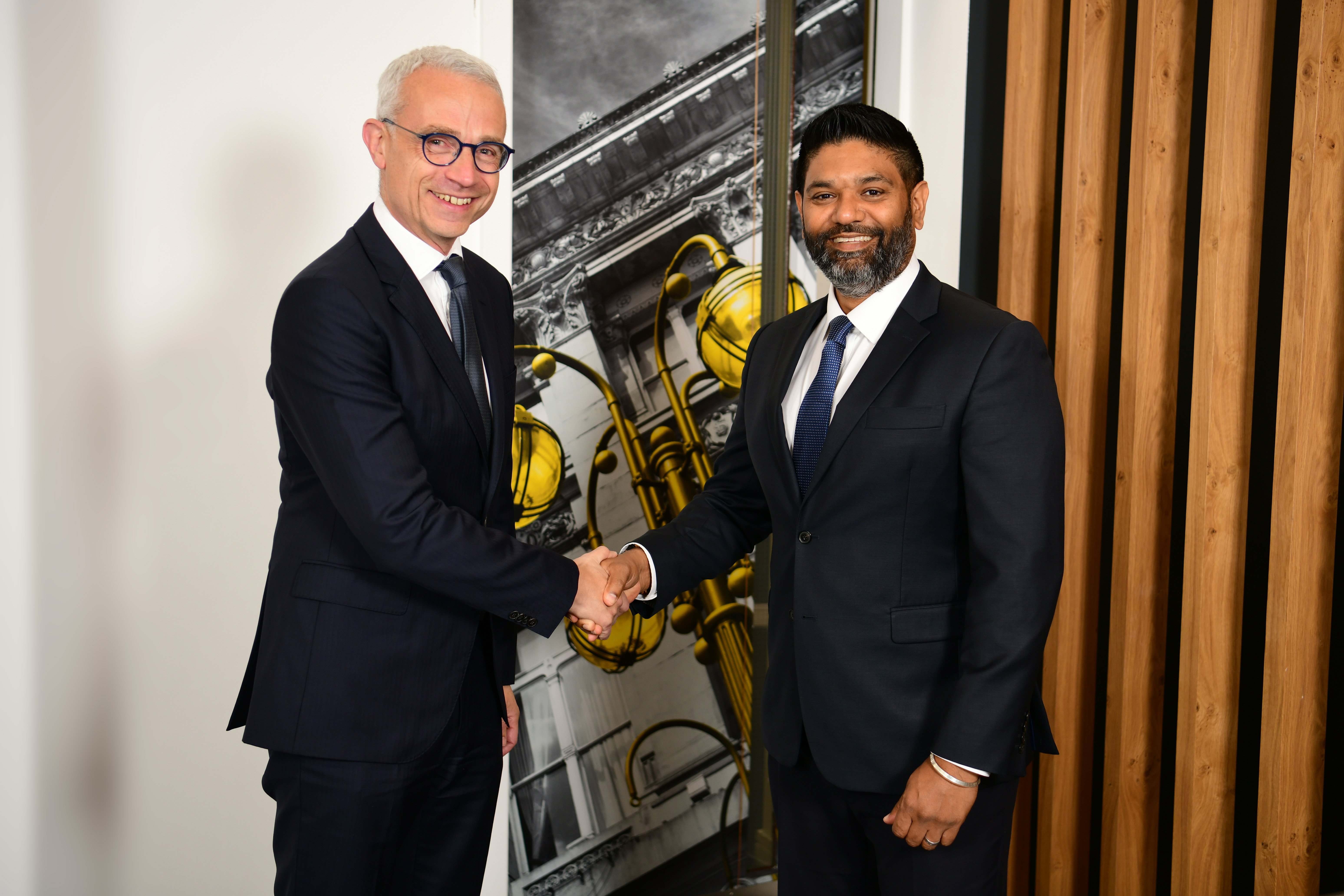 Andrew Rankin and Prakash Kerai shaking hands