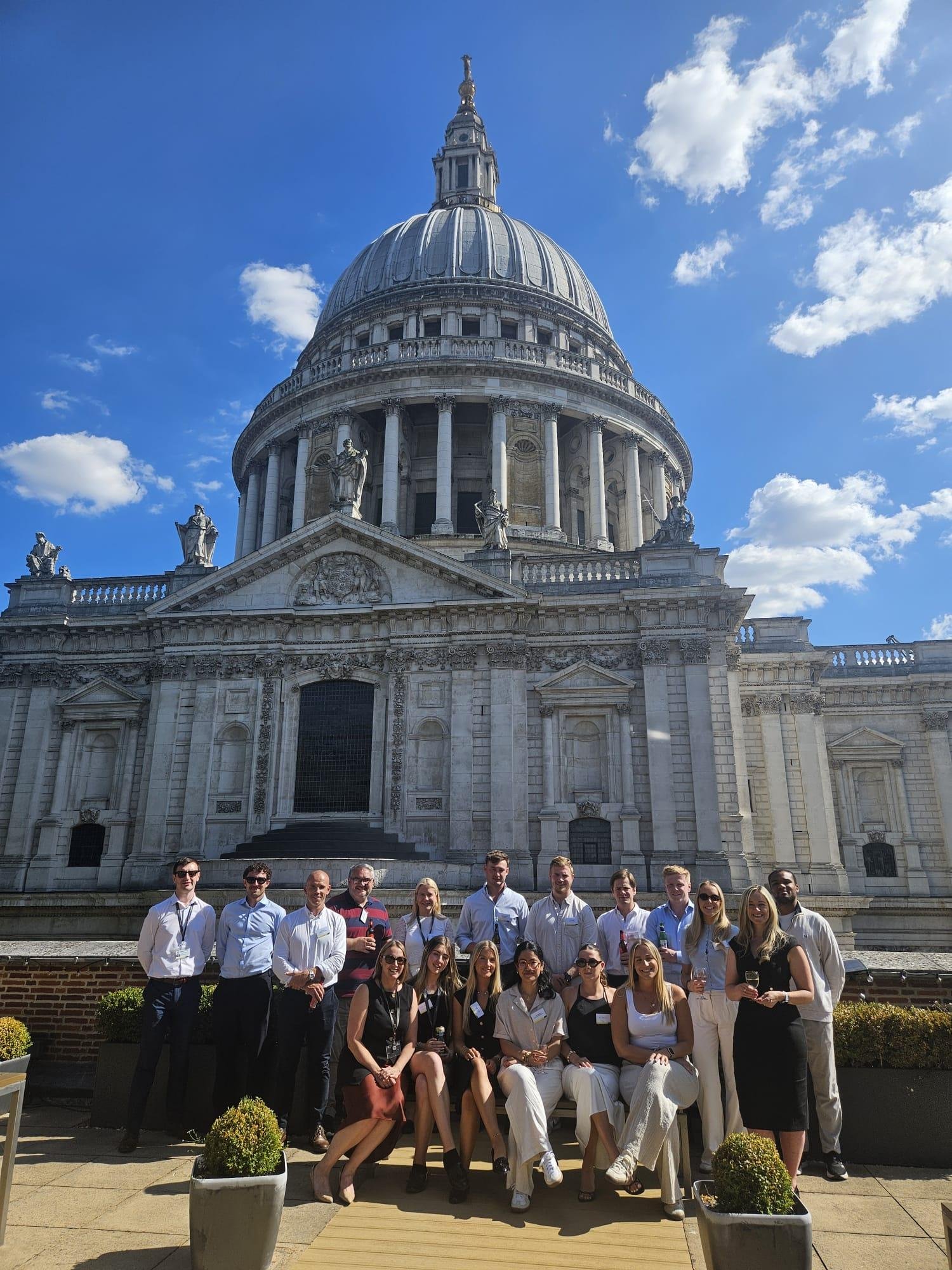 Photo of co-hort 2024-25 celebrating course completion on the London office terrace
