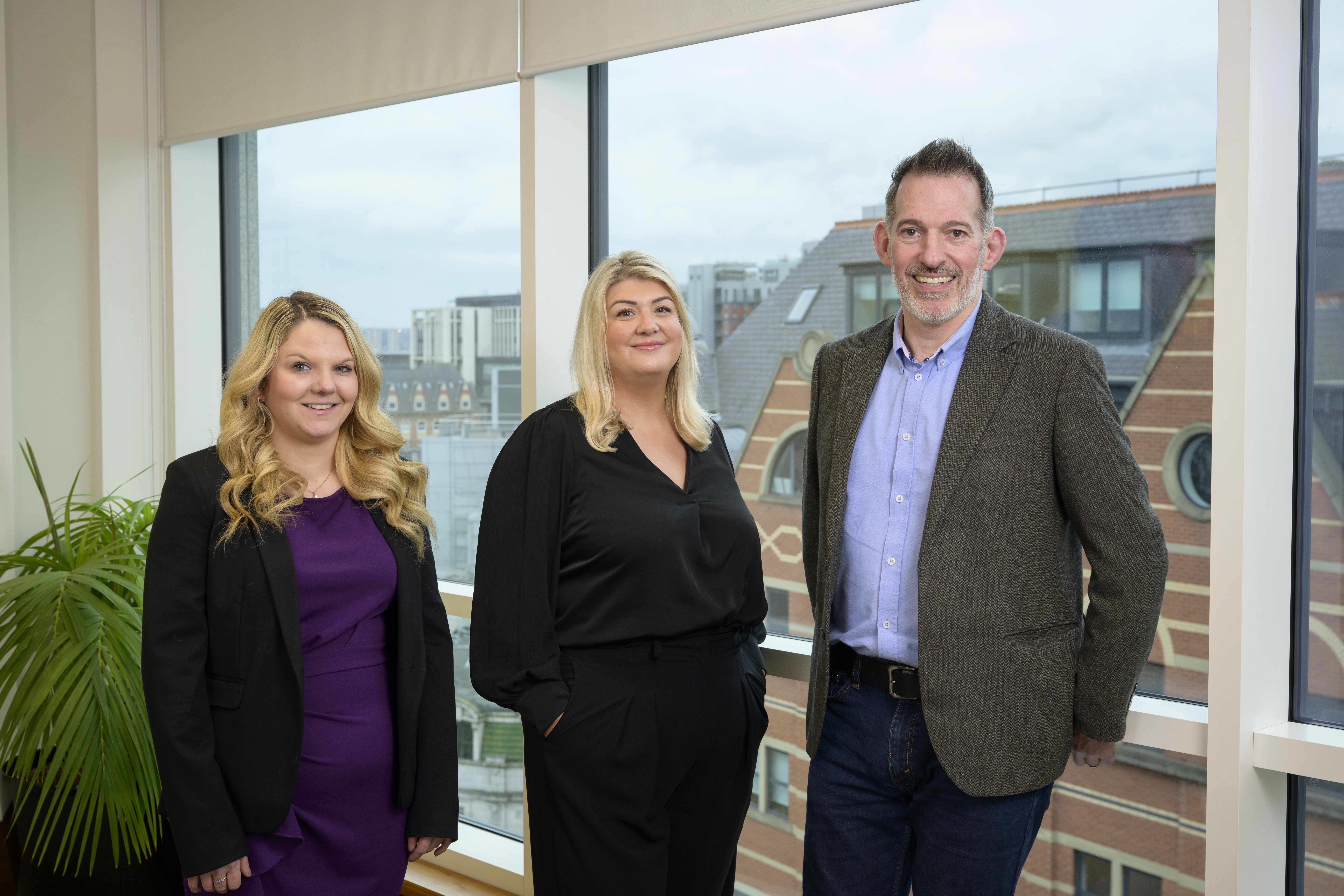 Photo of new hires Libby Clarkson and Kate Develly with Roger McCourt