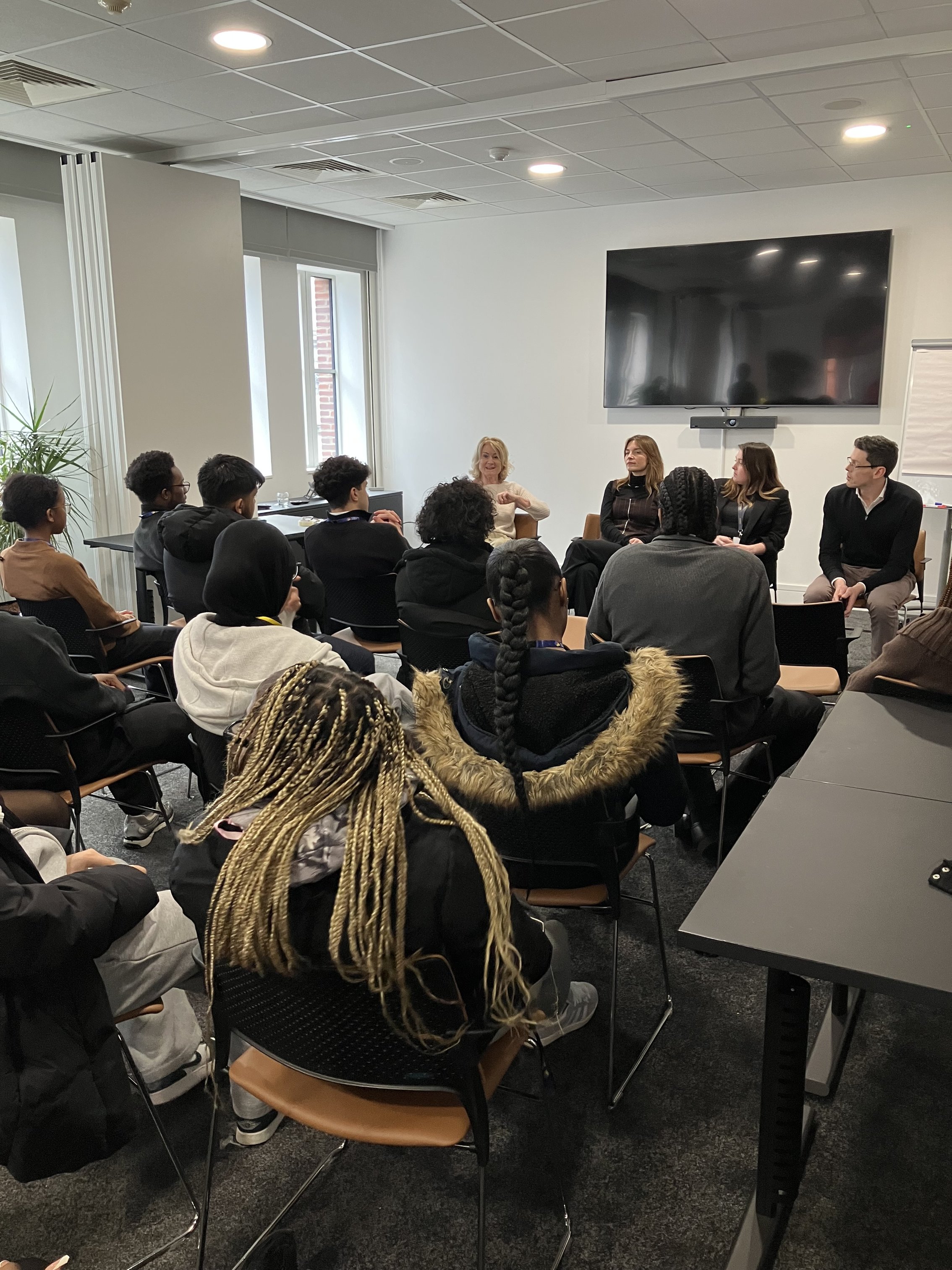 The students listening to the talk from our experts