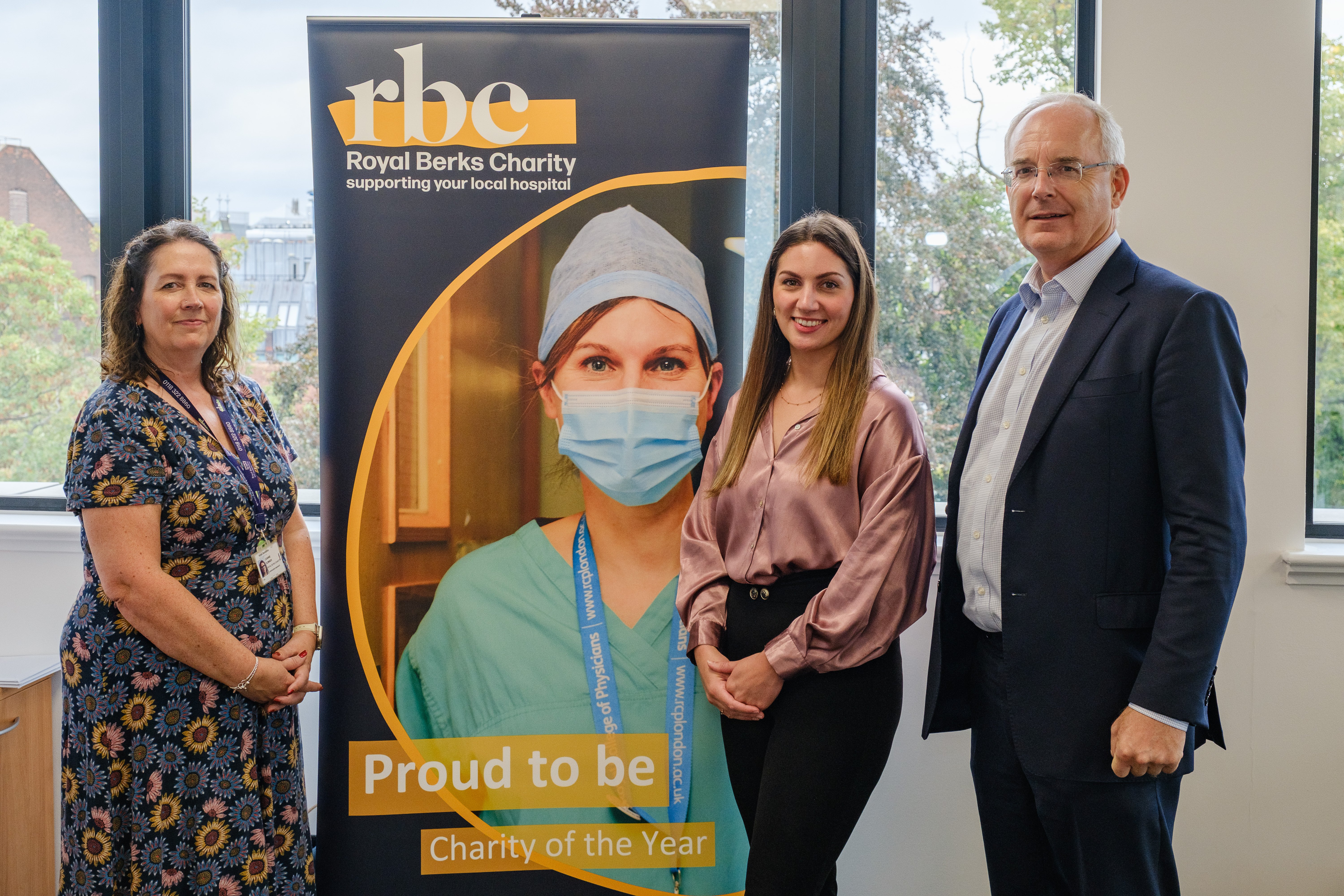 Two members of our team smile with corporate and major gift fundraising manager at Royal Berkshire Hospital Charity