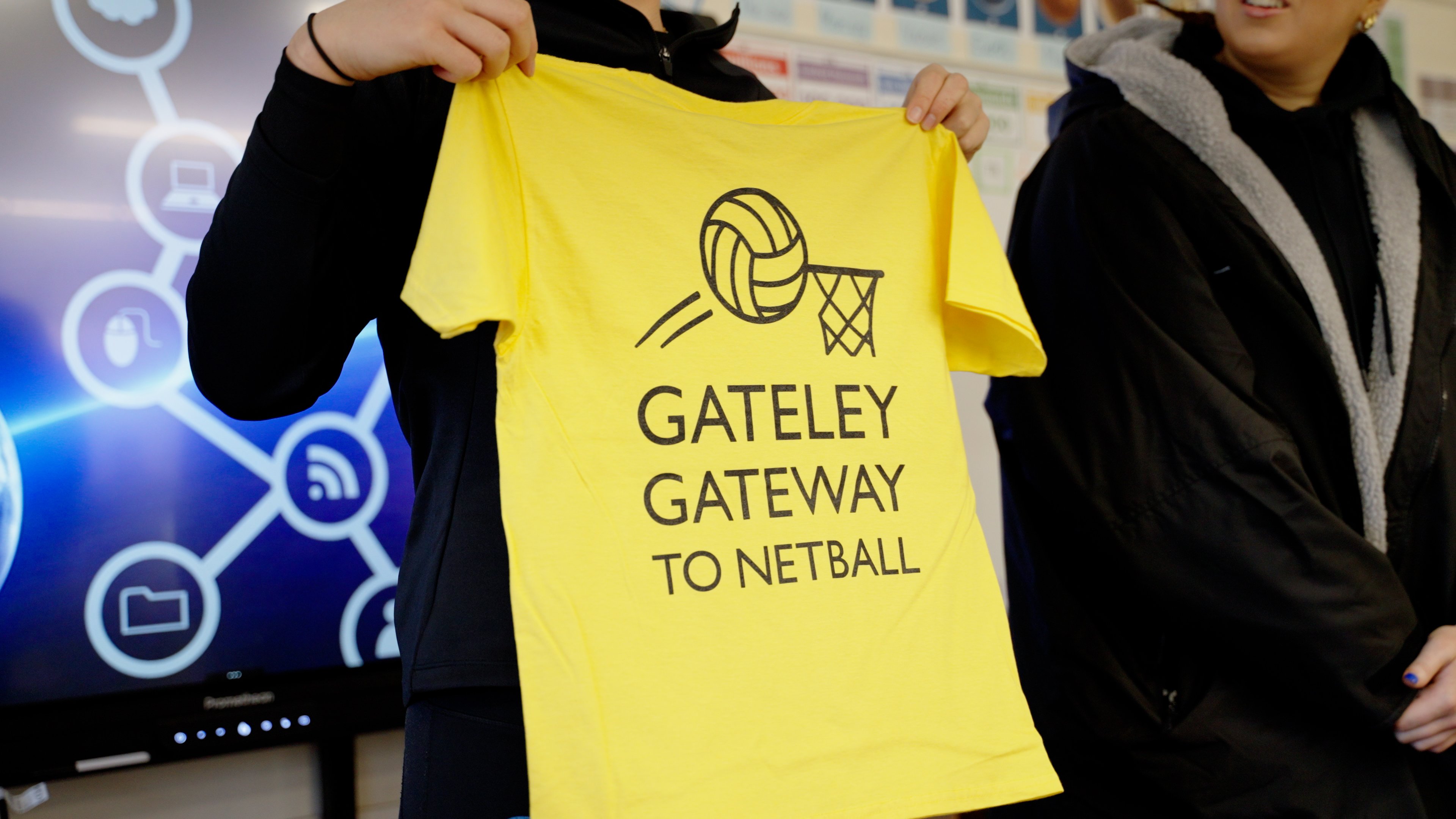 Yellow sports t-shirt that reads Gateley Gateway to Netball