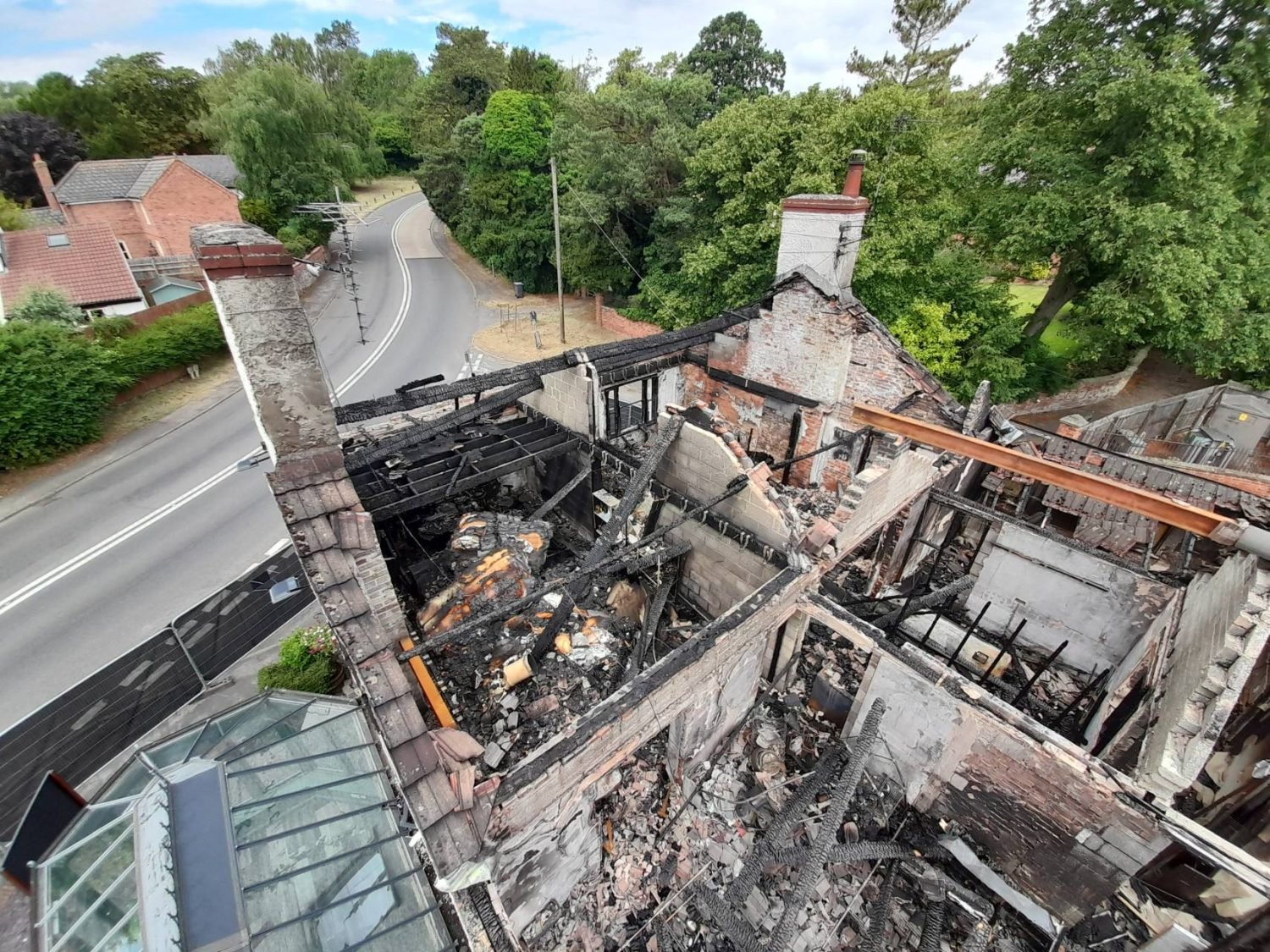 Photo showing fire damaged Tap and Run pub