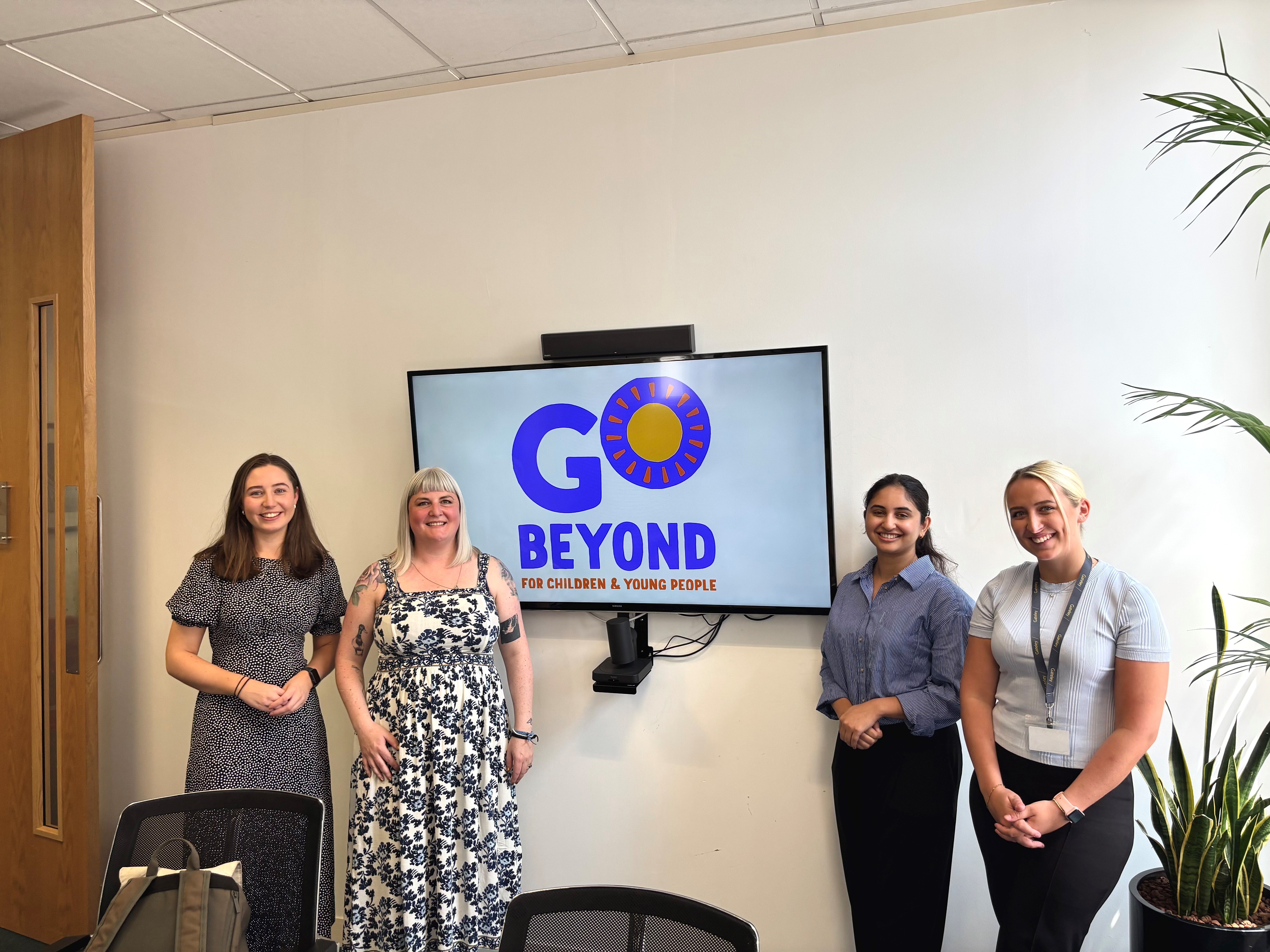 Gateley team smile with members from Go Beyond