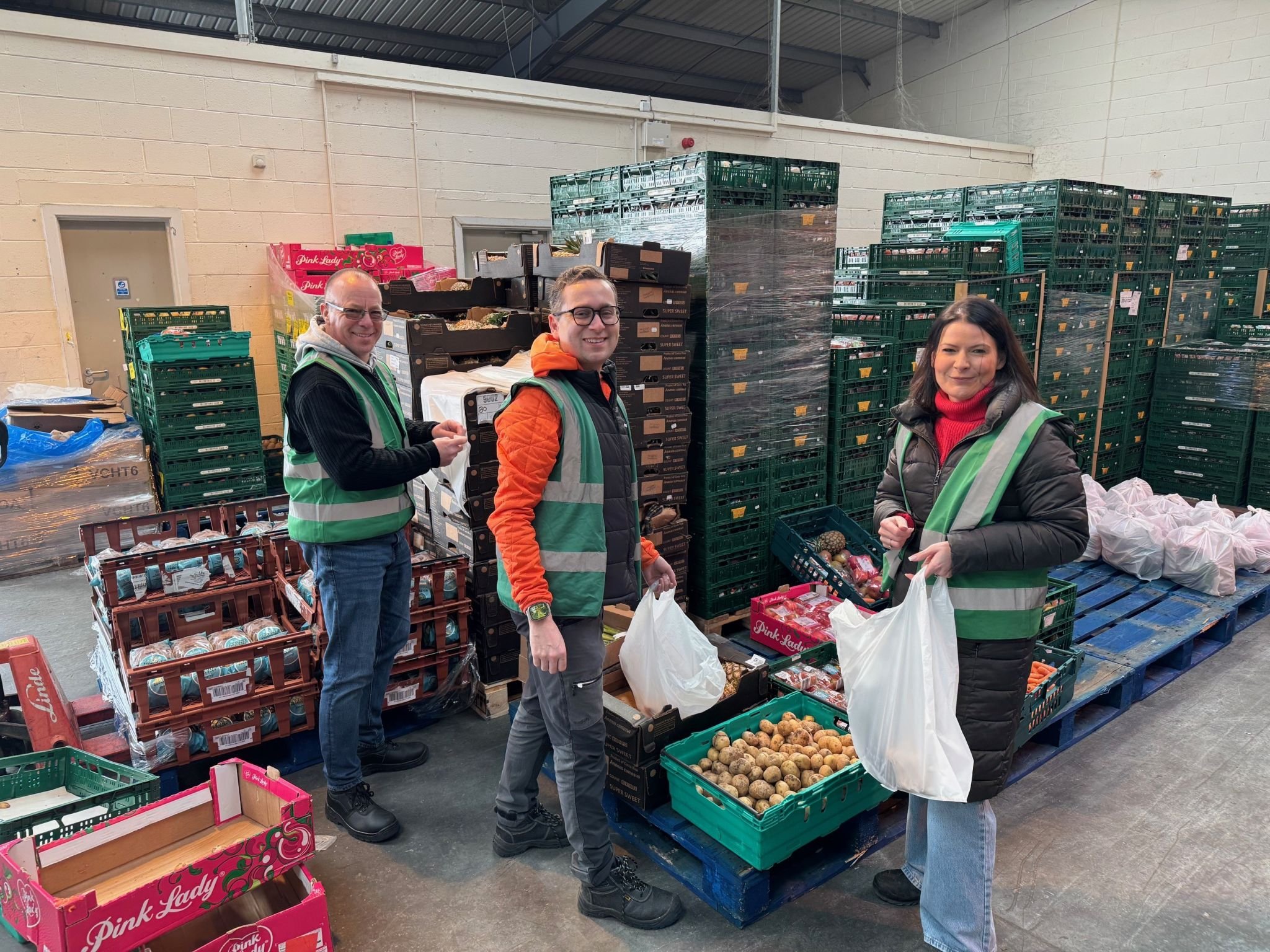 Photo of colleagues sorting food donations