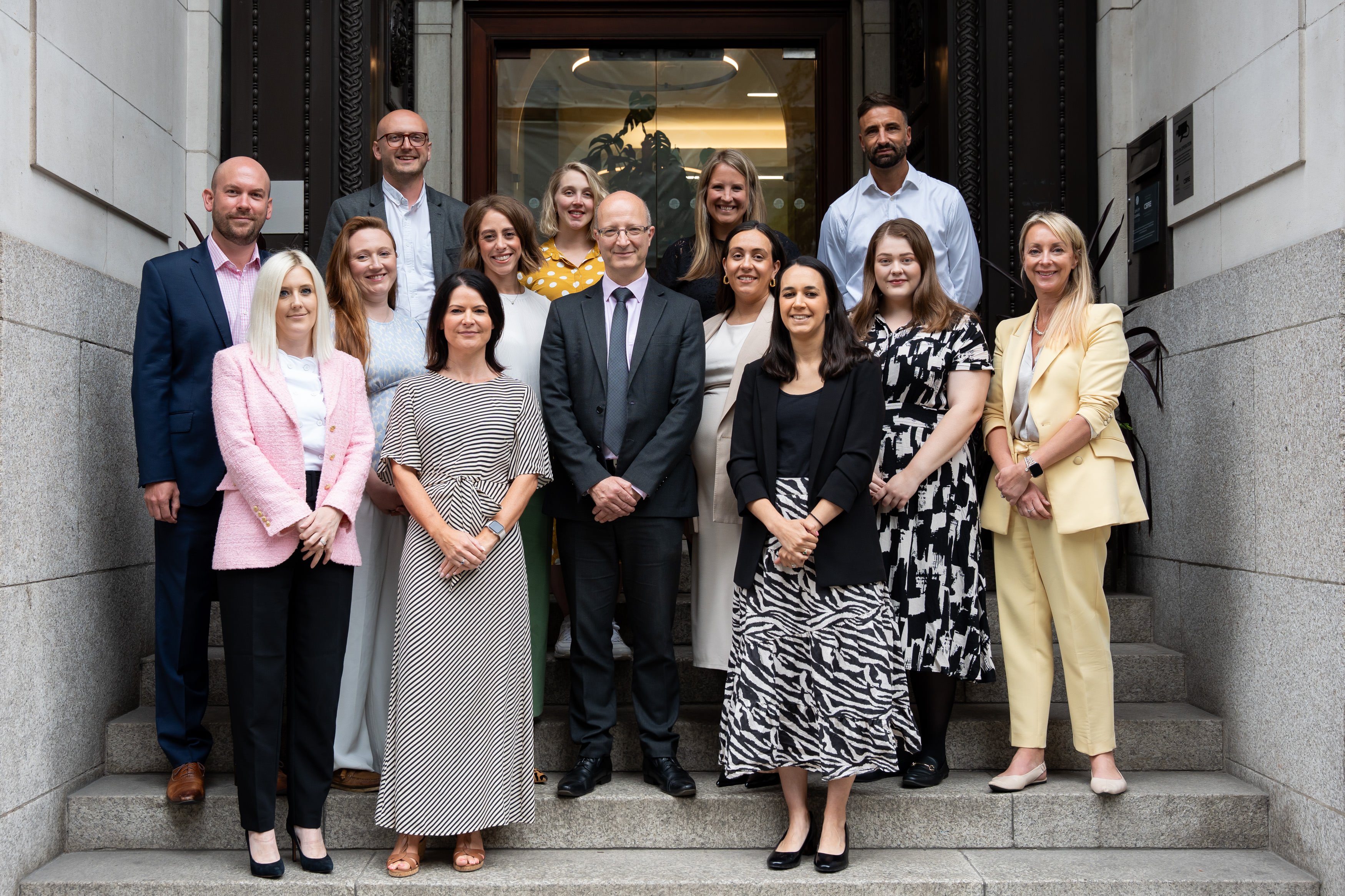 Photo of promoted Manchester colleagues July 2025